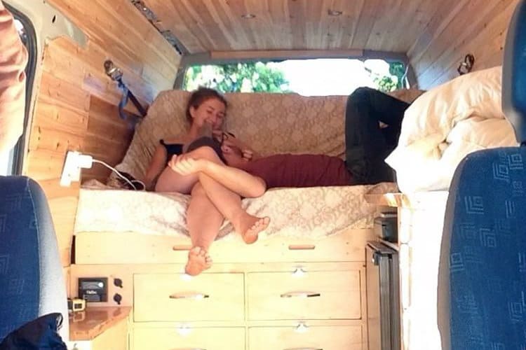 kaya on bed inside van