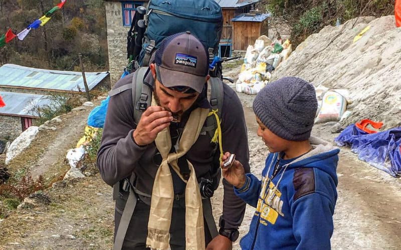 Jesse teaching kid harmonica