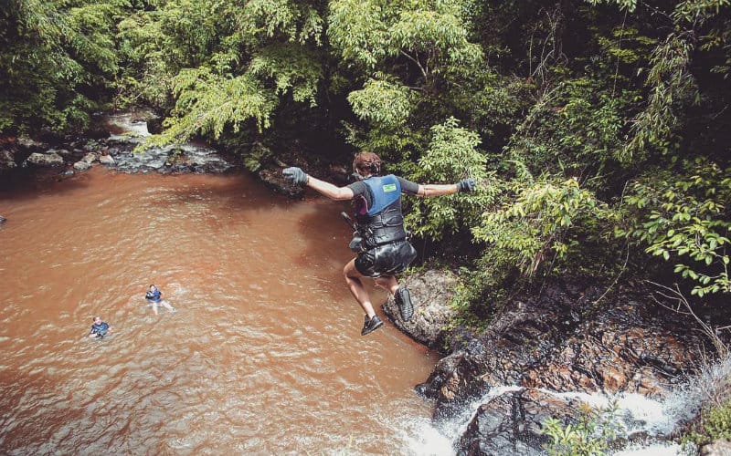 Welker jumping off waterfall