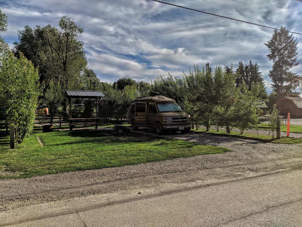 Camper van parked at a KOA campground