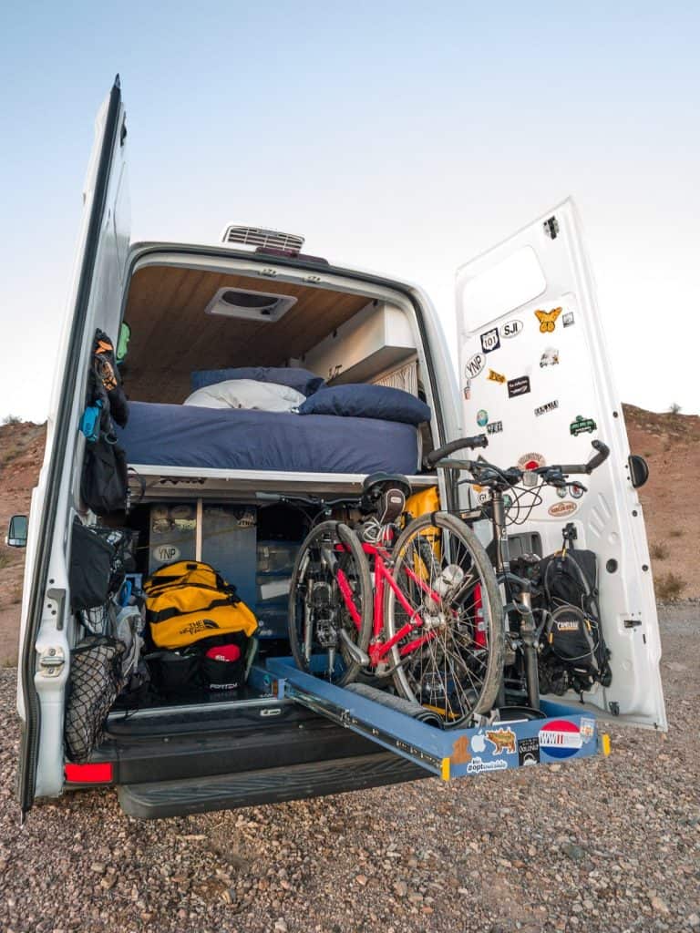 The rear of the Sprinter with the back doors open, we get a great glimpse of their "garage". Their mountain bikes slide out and there is ample space for additional storage for more outdoor gear as well as water.
