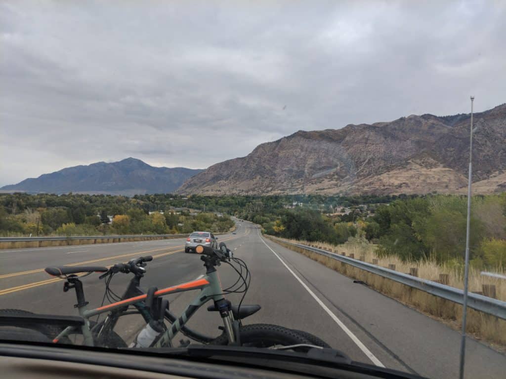 View from the driver's seat as a van drives through some beautiful hills in south dakota