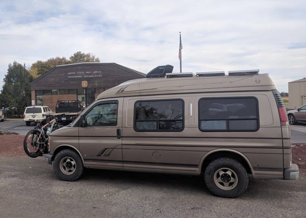 Van parked outside of a post office