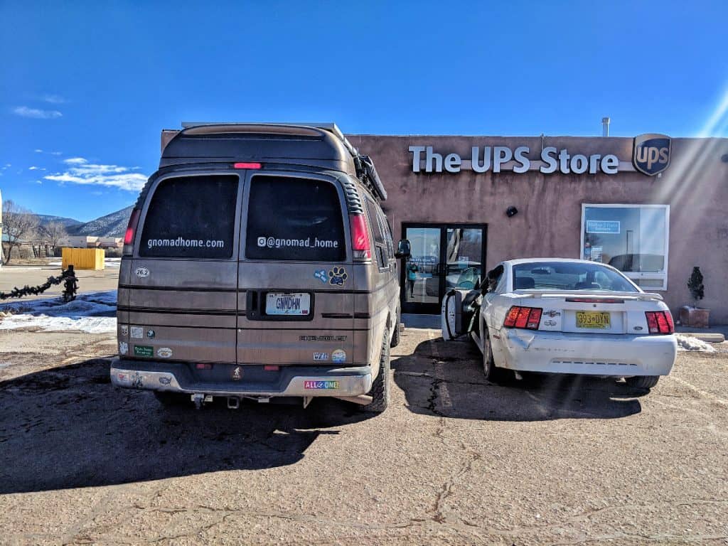 van parked outside of a UPS store