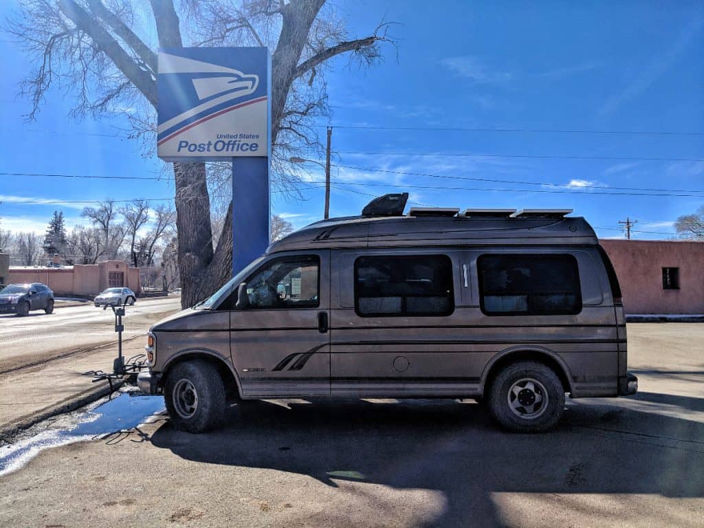 van parked outside of a post office
