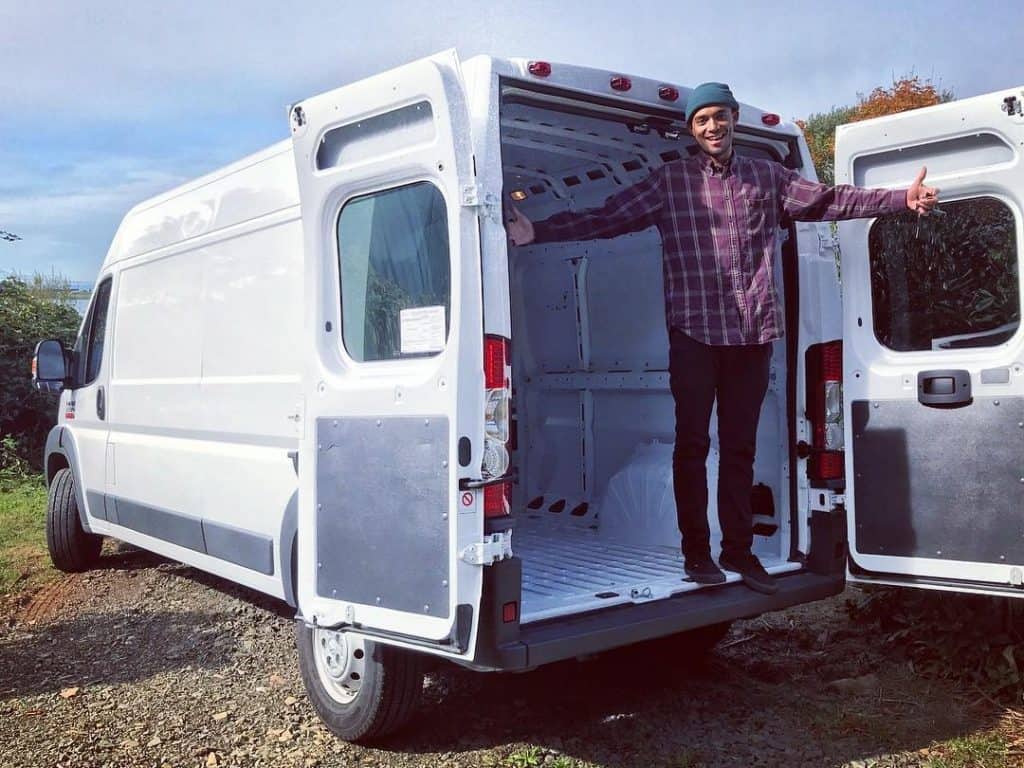 Man celebrating an empty van