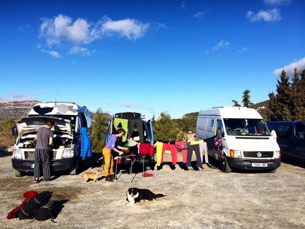 people doing laundry across multiple vans