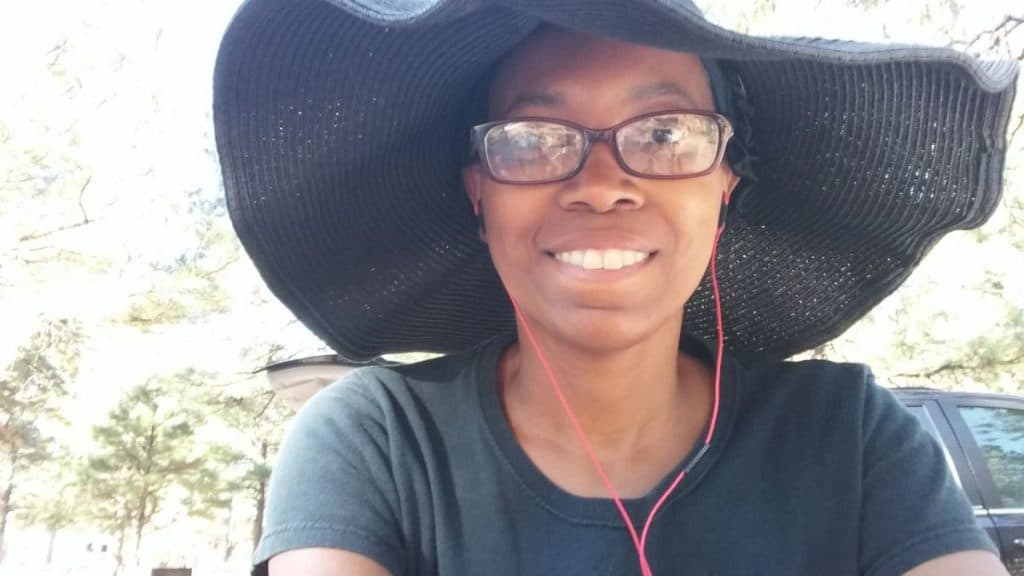 Crystal takes a selfie while rocking a wide-brimmed, floppy black hat