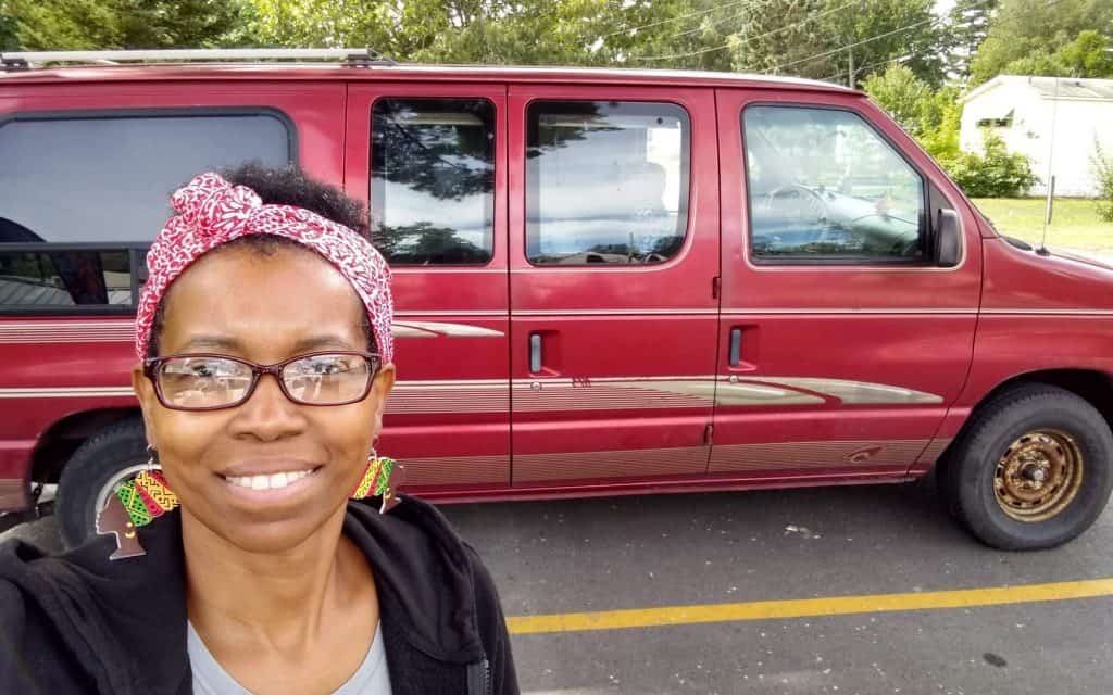 Crystal Vanner in front of her red van