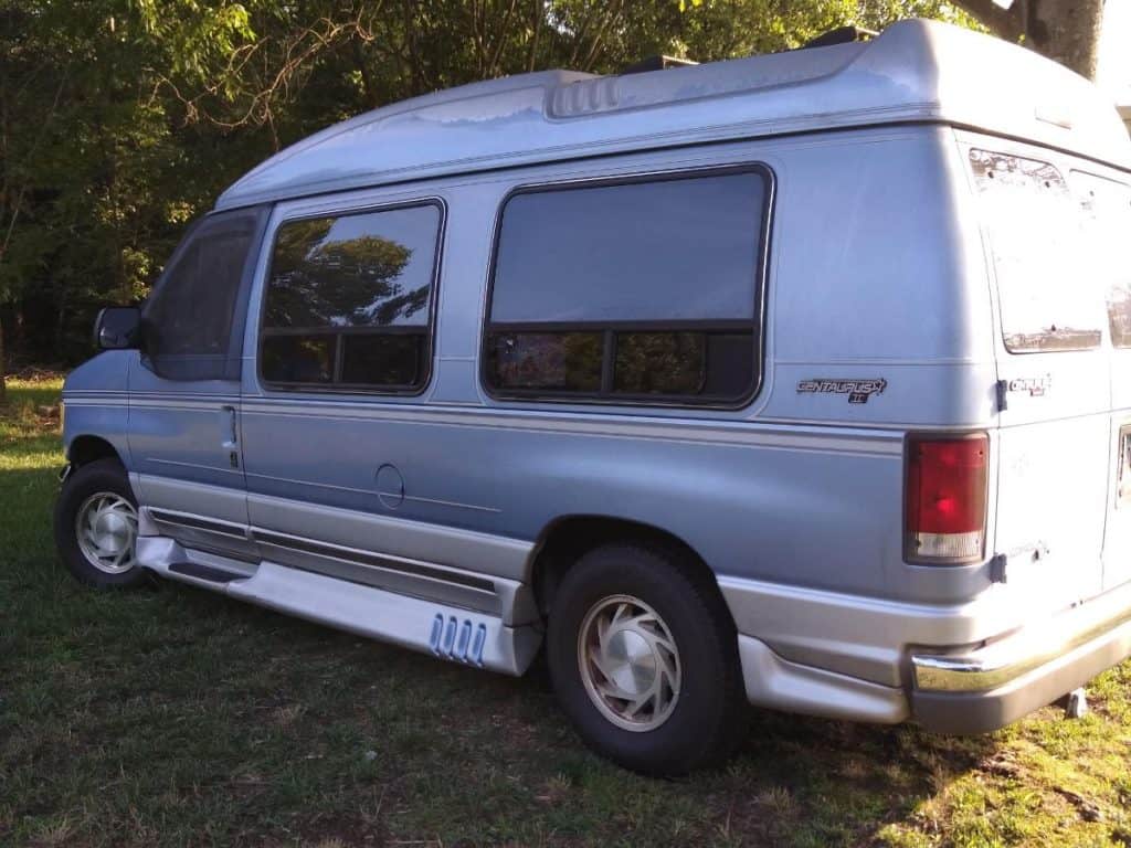 A white high top conversion van