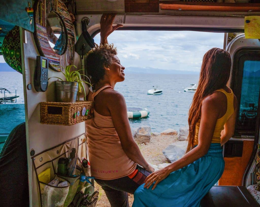 Nat & Abi hang out by the side door, looking out at the ocean.