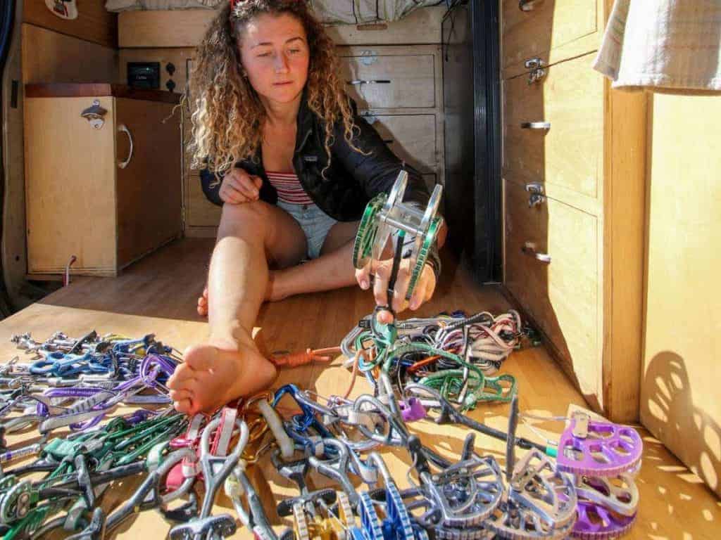 Kaya sits on floor with a bunch of cams.