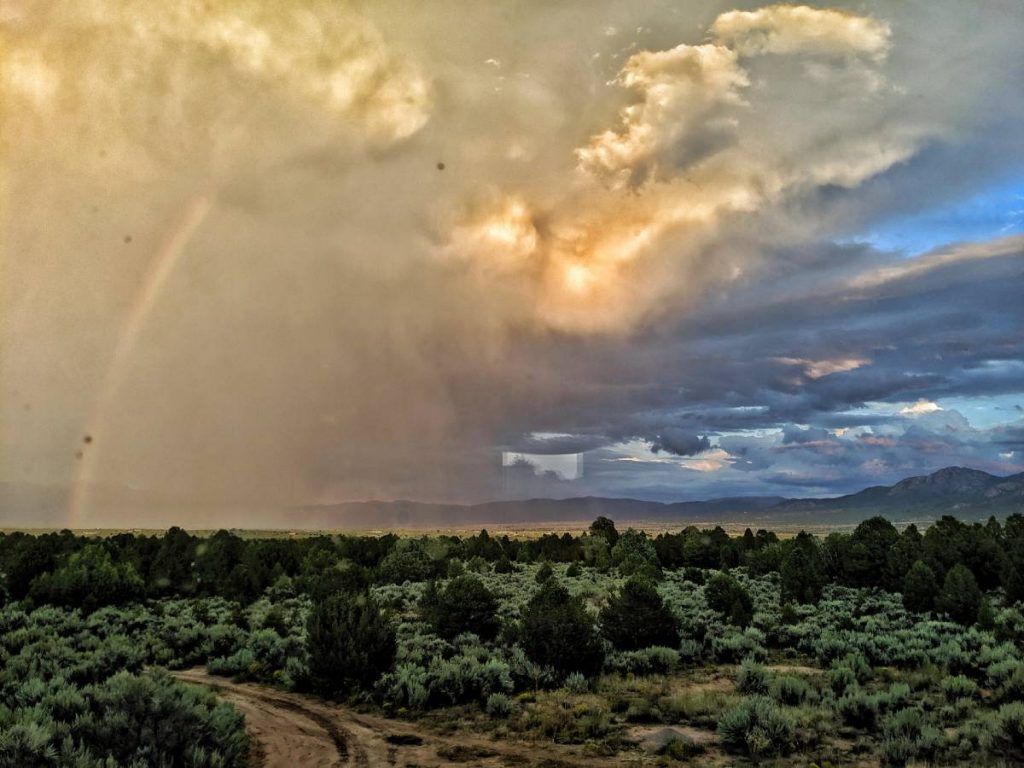 blue skys rainbow and storm 1200x900 1