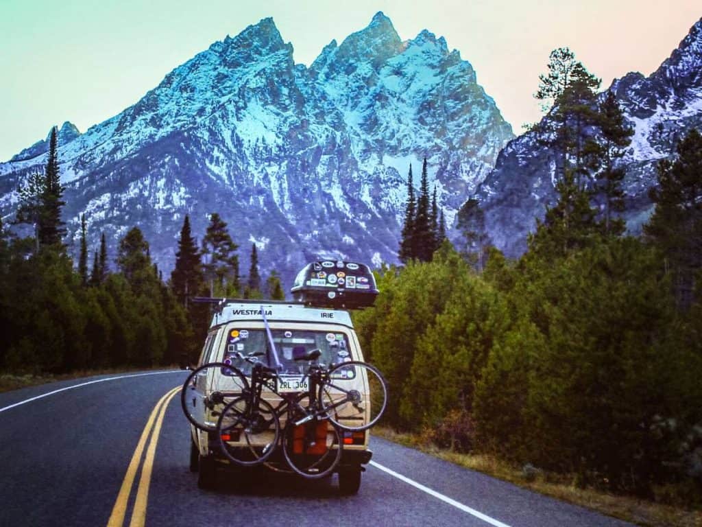 The van driving through the Tetons.