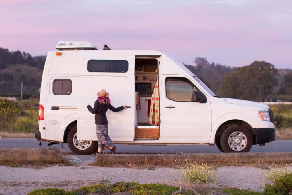 Lisa Jacobs opening side door on her Nissan NV2500