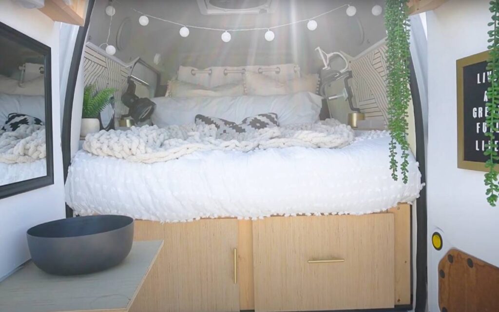 @caracelestewest Bed inside a transit connect camper with under bed storage