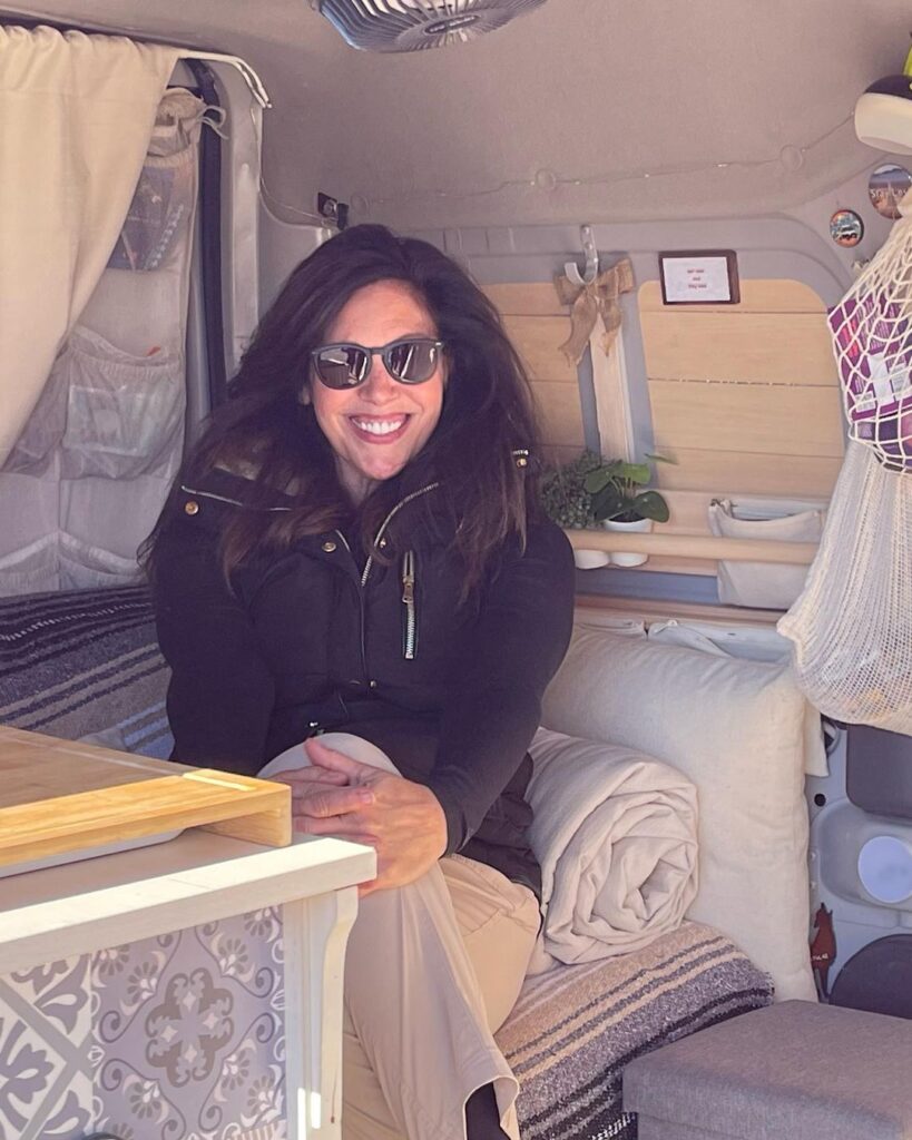 @ladybug.out Woman sitting inside ford transit connect camper van