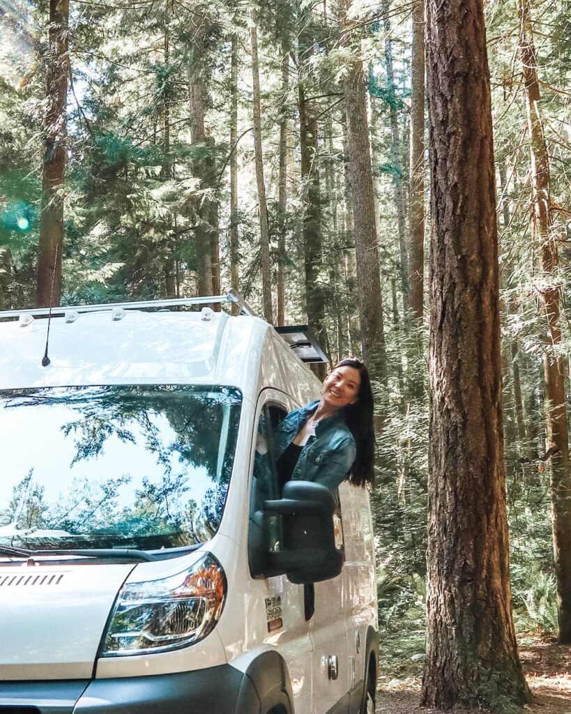 @emsvanlife Woman leaning out of camper van window