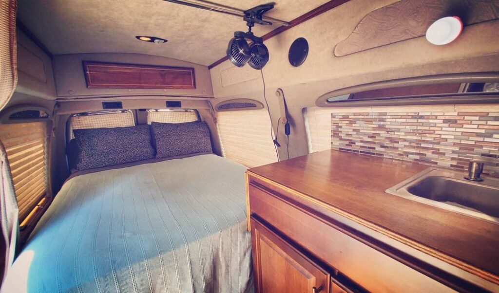 @isaacangel1 Chevy express camper van with bed and sink