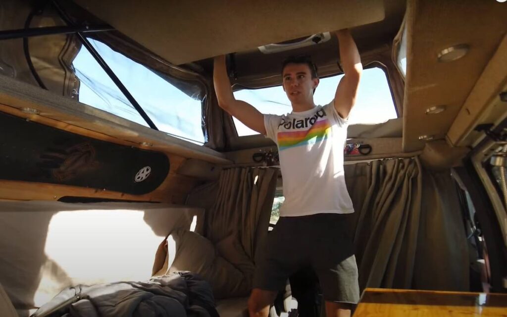 @seth__rice demonstrating how the chevy express camper van pop top roof works