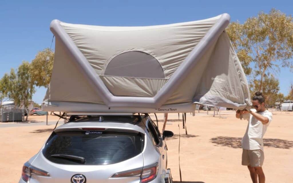 @cjexplores car turned into camper with a rooftop tent