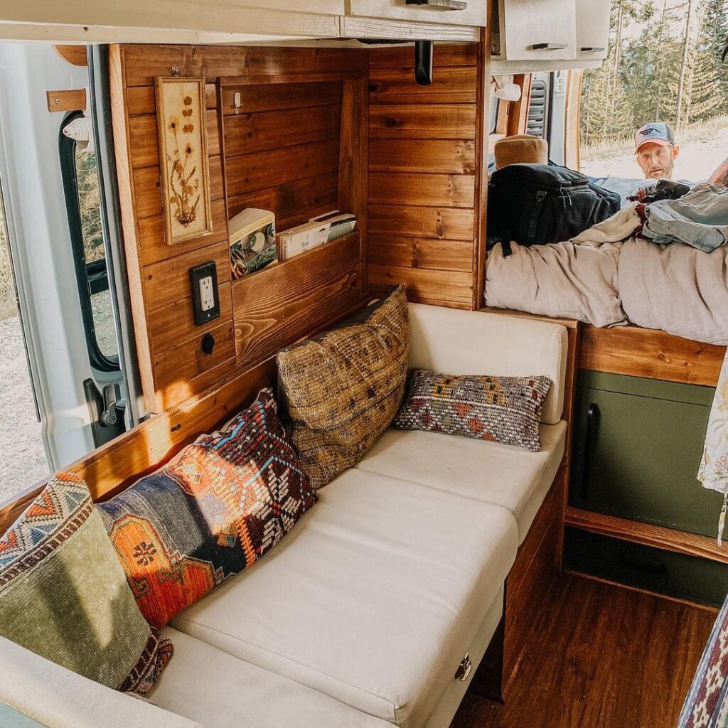 @vanhalla_adventures Comfortable couch inside a ram promaster camper van