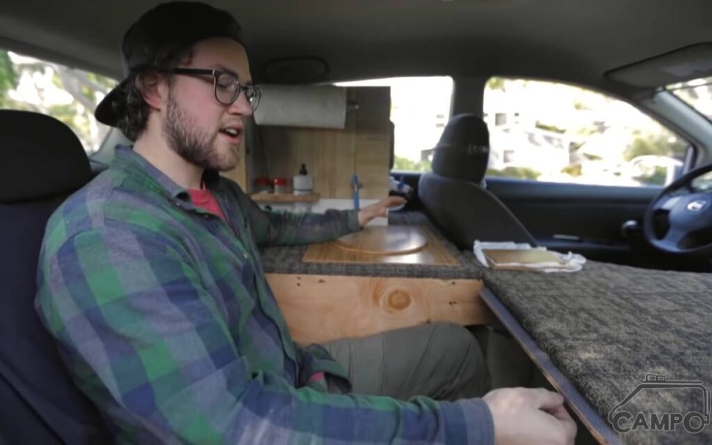 Joey showing the interior of his car camper