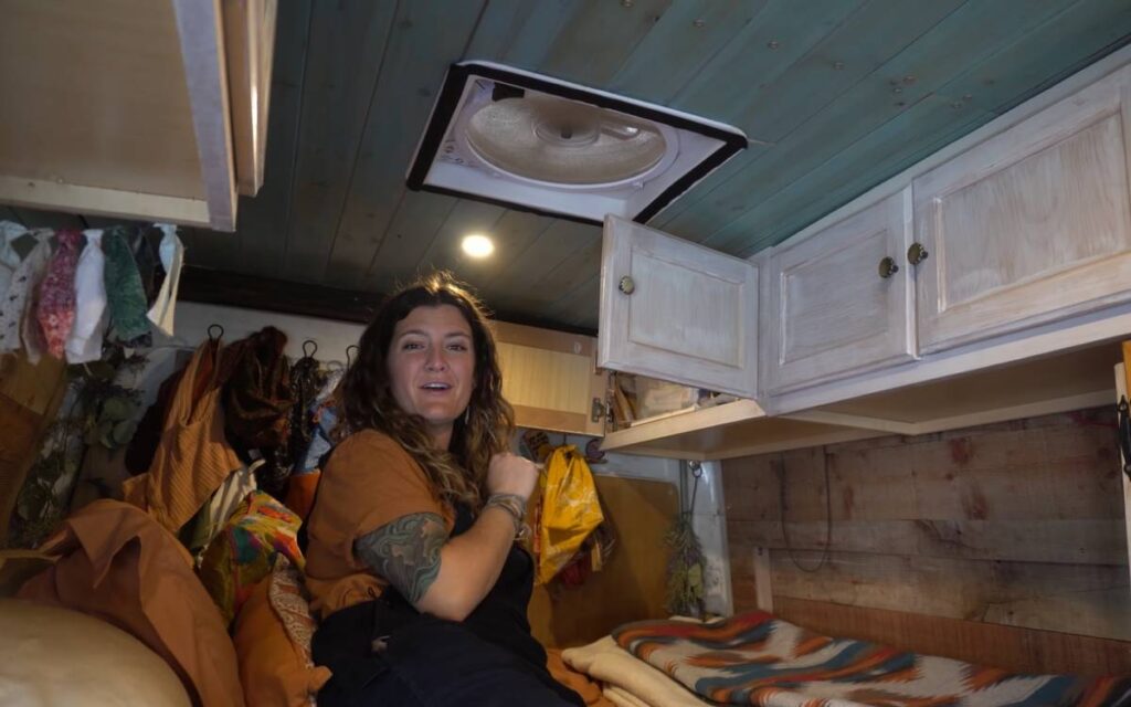 @aimless.amber Woman inside a converted sprinter van