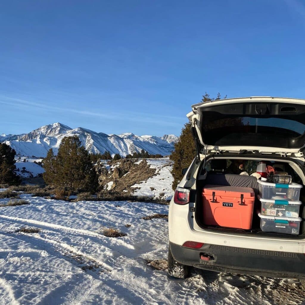 @citygirlunplugged camper suv parked in the mountains