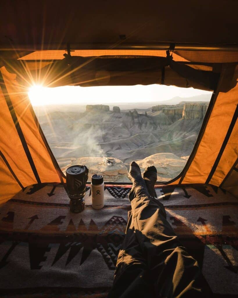 @drew.simms View of mountain landscape from a camper suv's rooftop tent