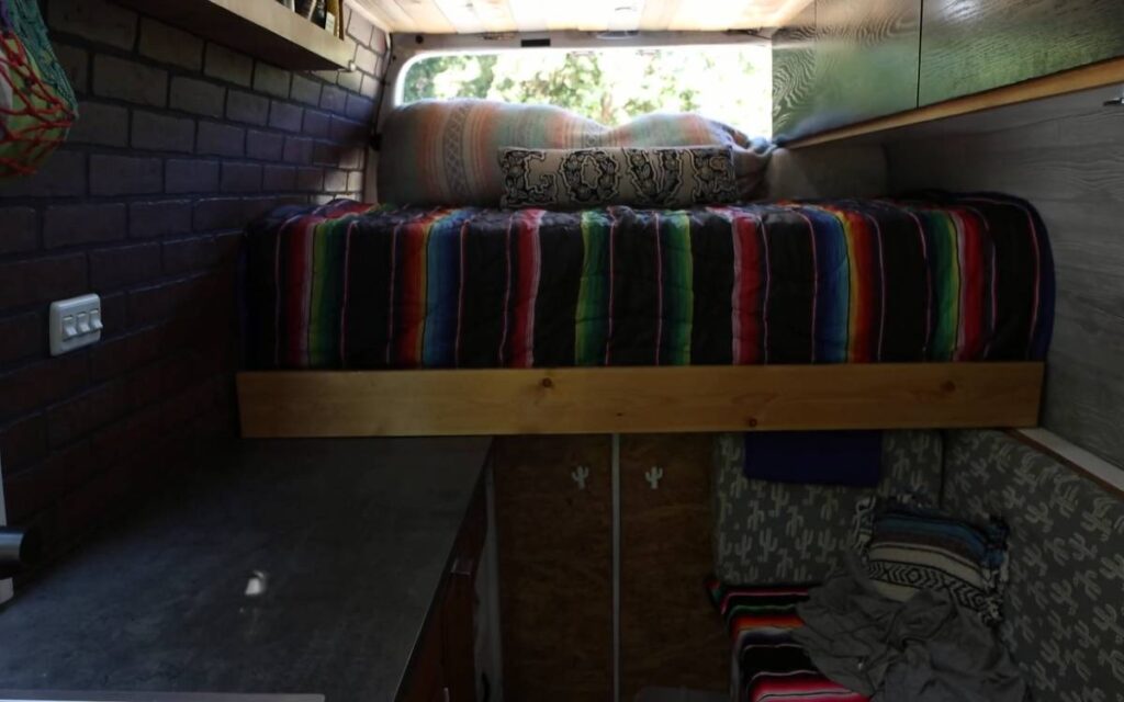 @vankookz bed inside a converted sprinter van