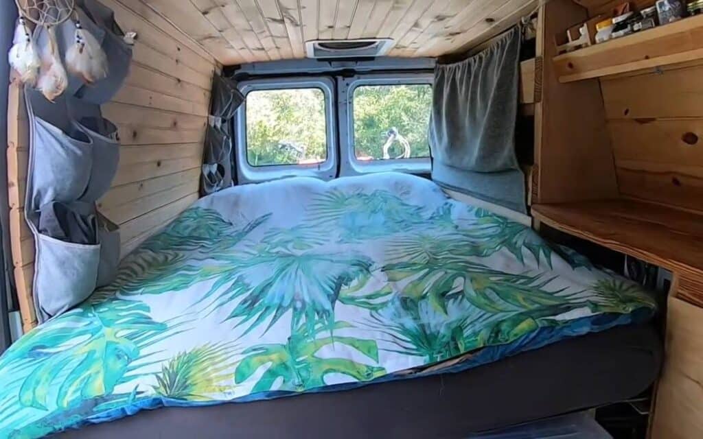 @wander.green bed inside ford econoline camper