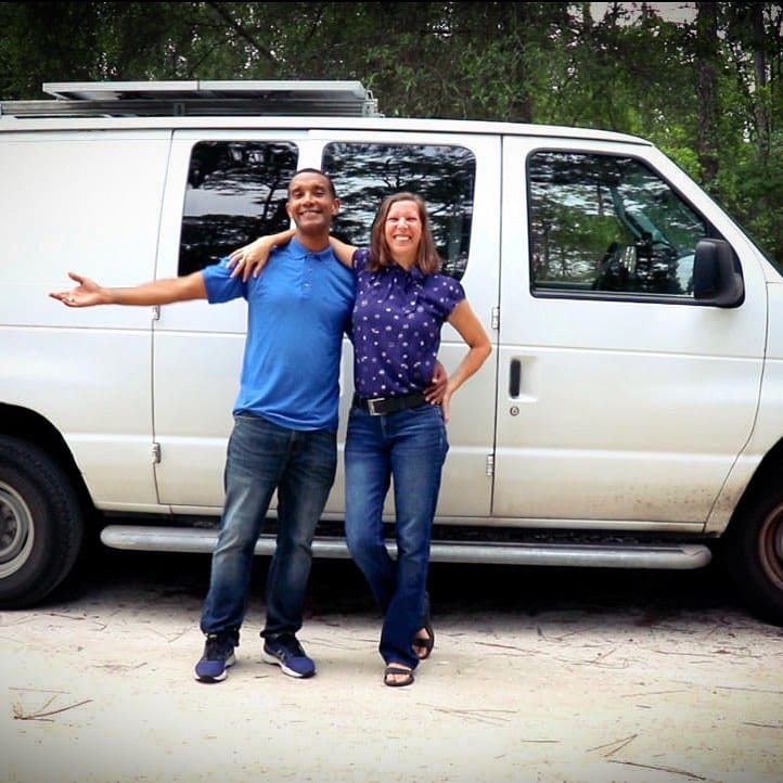 @wander.green couple standing in front of ford econoline camper