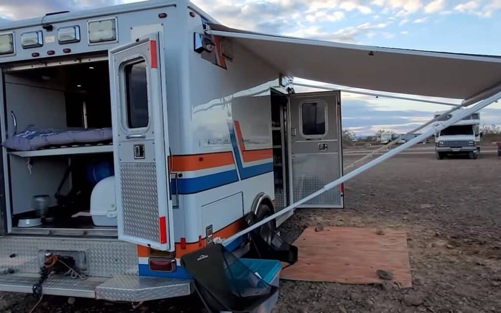 Kojo's converted emergency medical vehicle exterior with awning