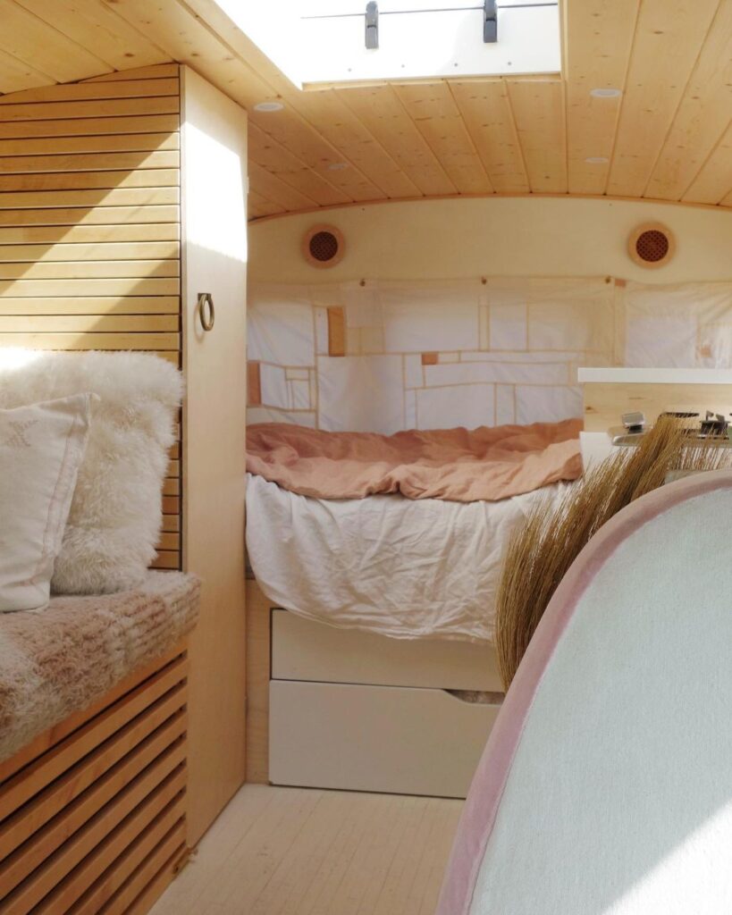 @littlehomebus converted short bus cozy interior