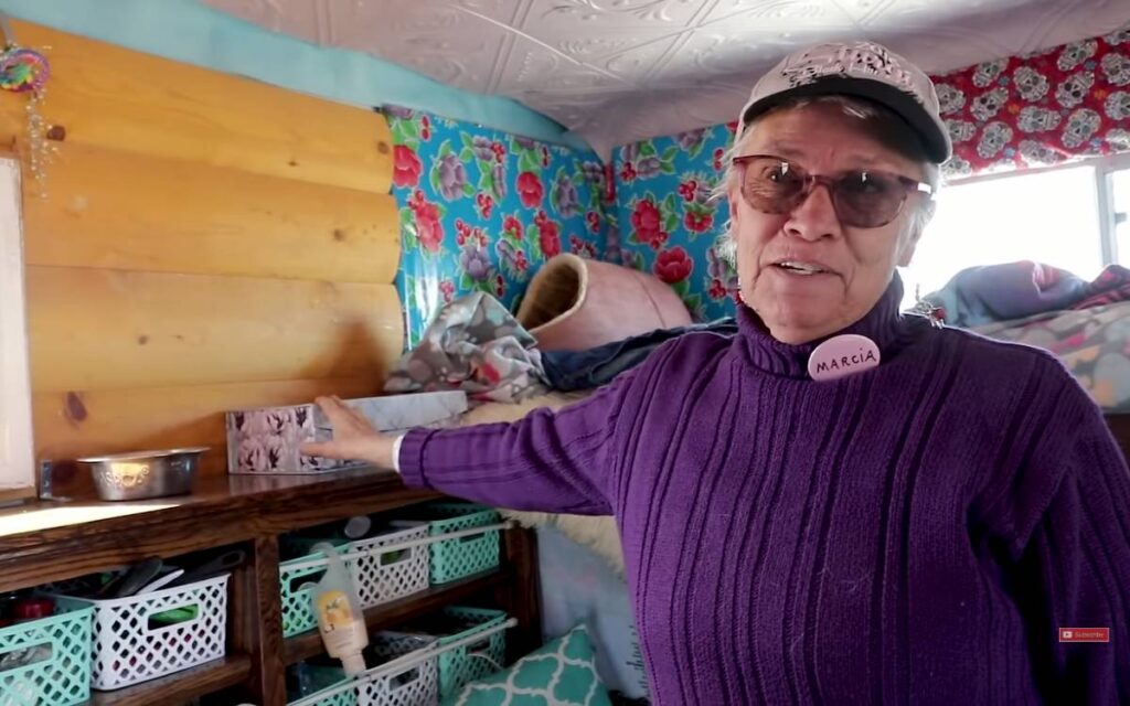 Marcia showing what's inside her converted box truck