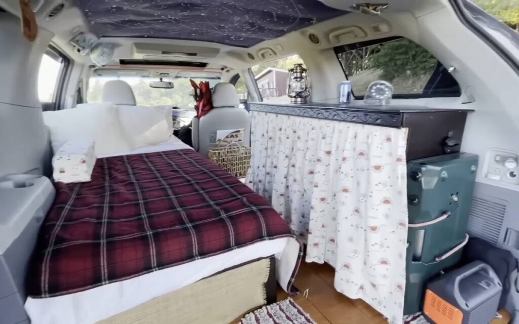 @beer_in_beautiful_places Toyota Sienna camper conversion cozy interior