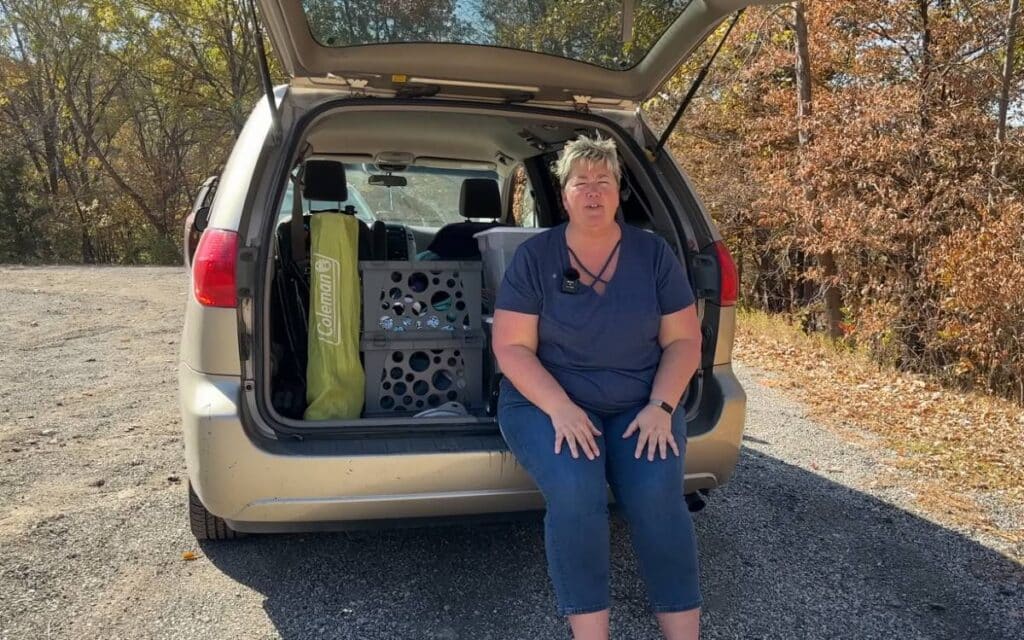 Dani sitting in the back of her Toyota Sienna camper