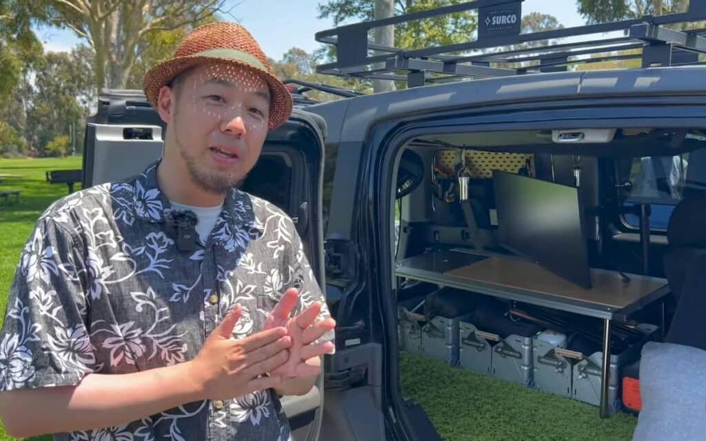 Kenji giving a tour of his honda element conversion, sharing ideas for van life
