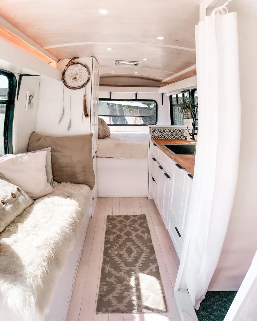 @thegloriaceleste charming shuttle bus conversion with white and soft neutral color theme interior