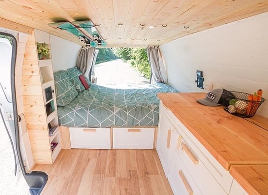 Bed in a camper van with minimalist interior