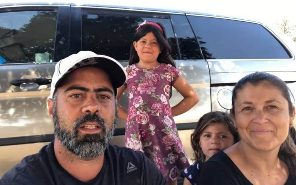 Fabio and his family next to their campervan