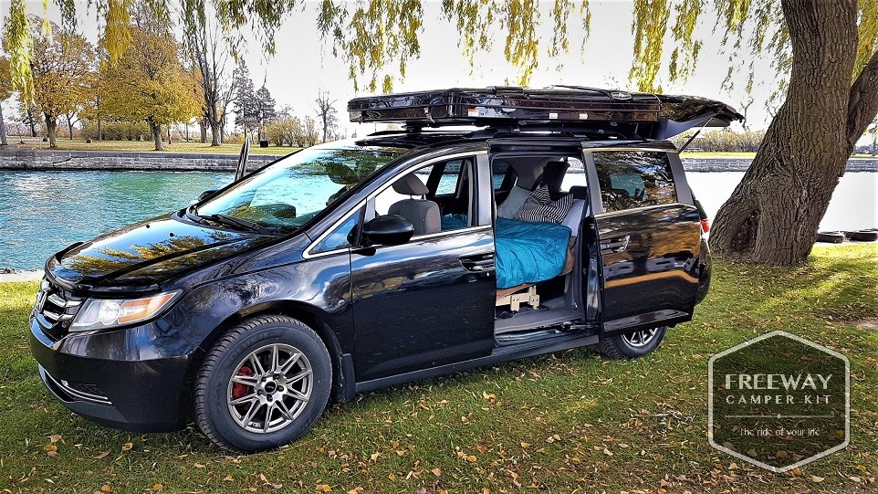Freeway camper kit installed in a black Honda minivan