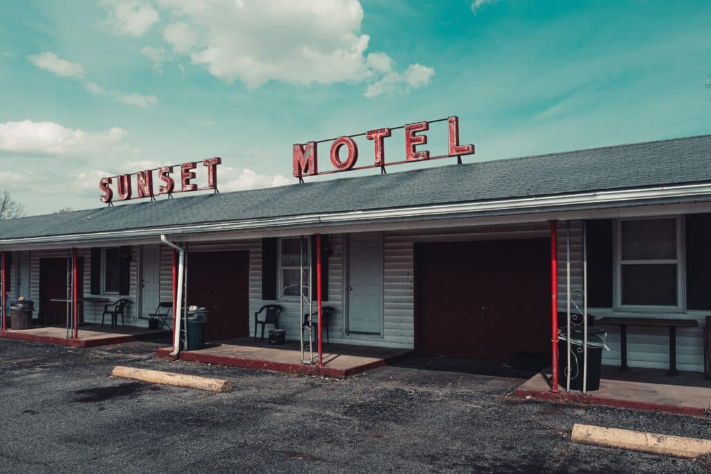 Front view of a motel with a rooftop sign