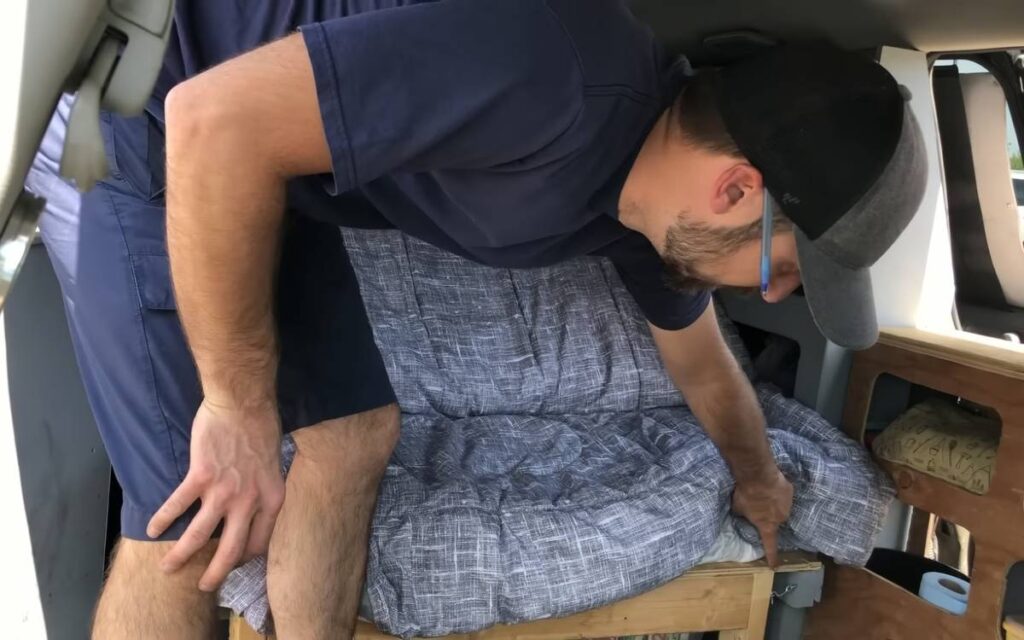 Mark showing his convertible campervan bed