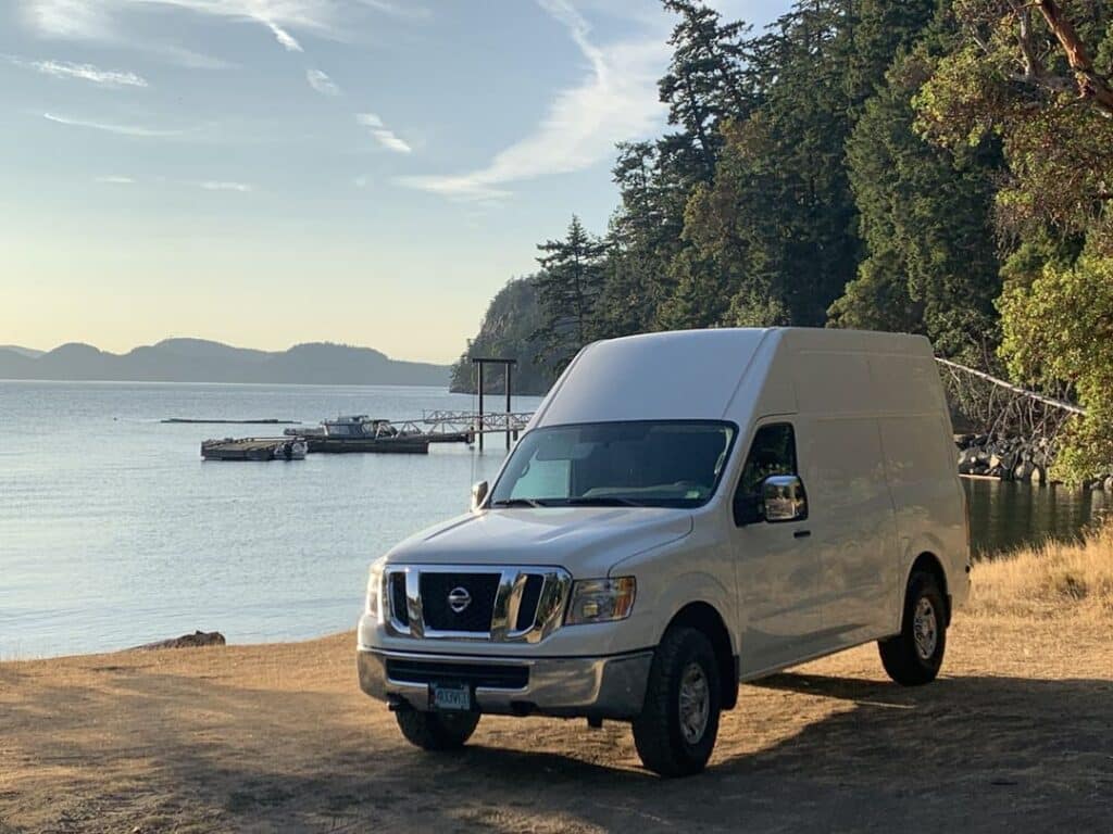 White Nissan parked on a beach