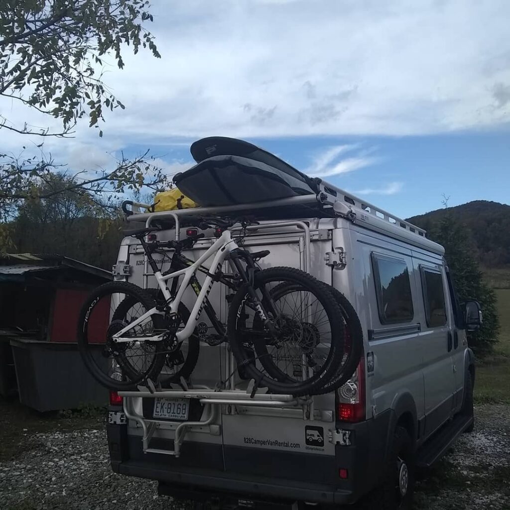 @828campervanrental Back of a campervan rentals van with bike racks 