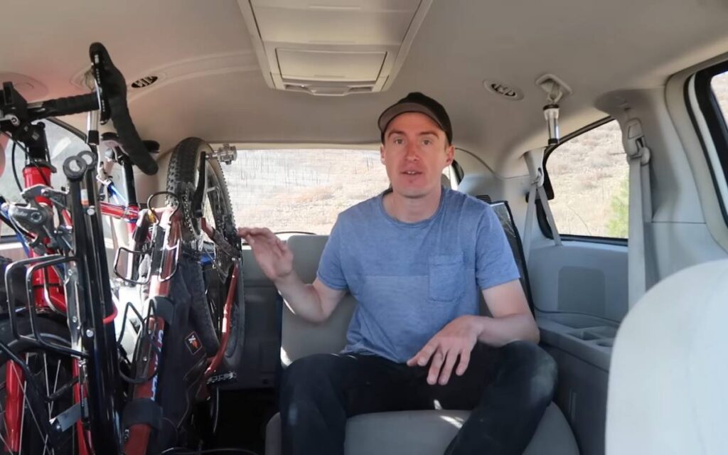 @bicycletouringpro Darren sitting in the back of his Dodge caravan with two bicycles stored on the passenger side