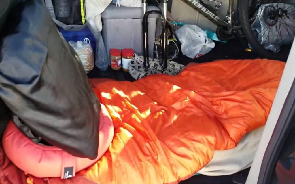 @divinezeal Pillows and a sleeping bag on top of a mattress, warm sleeping spot inside a caravan camper