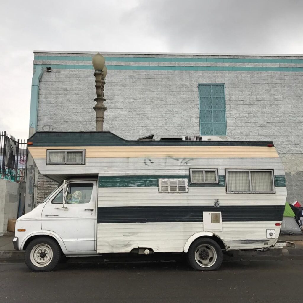 @dovcharney_losangeles White camper stealth camping on the side of a street